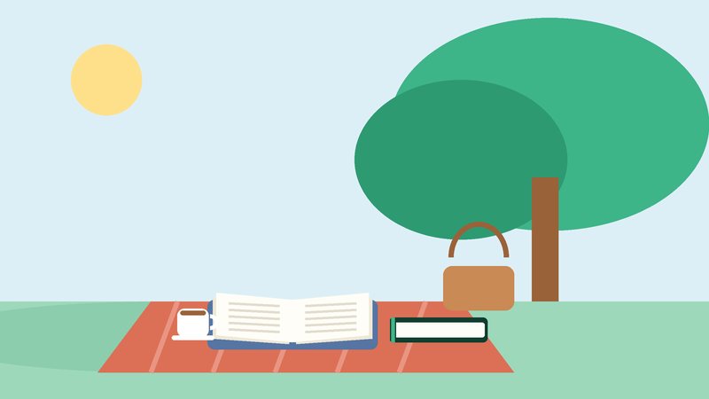 كتابٌ مفتوح على بساطٍ تحت شجرة