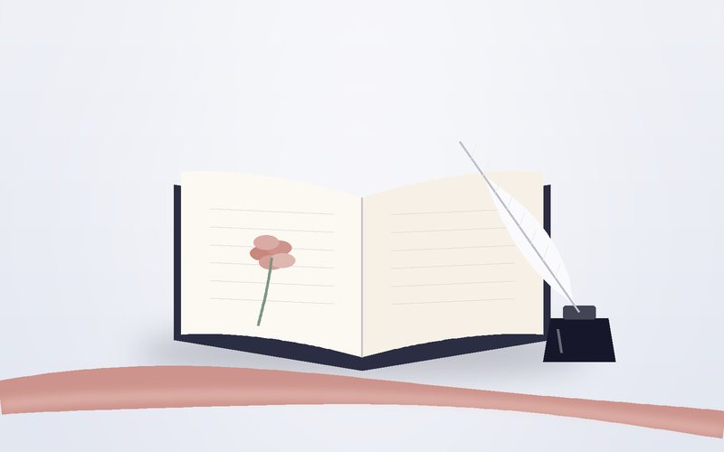 كتابٌ مفتوح بجانب ريشةٍ ومحبرة
