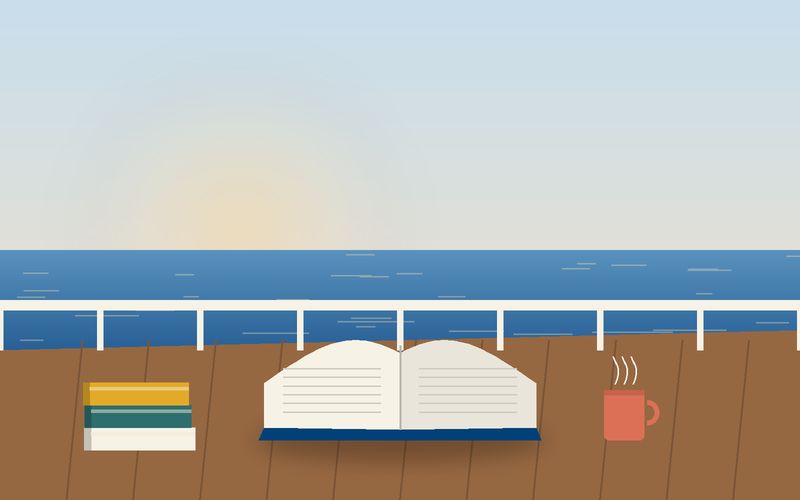 كتابٌ مفتوح على سطح مركبٍ أمام البحر