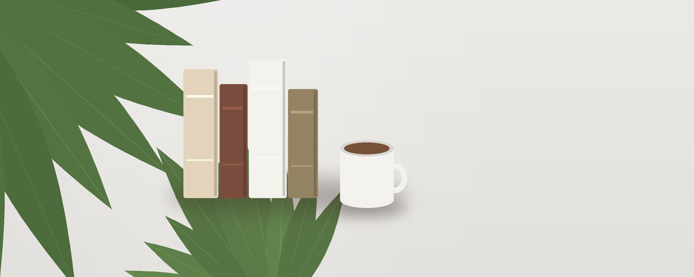 كتبٌ قائمة بجانب فنجانٍ وأوراق نخيلٍ خضراء